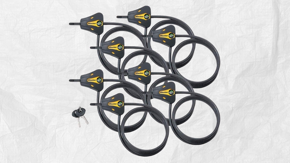 A set of six Master Lock Python adjustable cable locks with black heavy-duty braided steel cables and a keyed-alike system, shown with two keys on a white background.