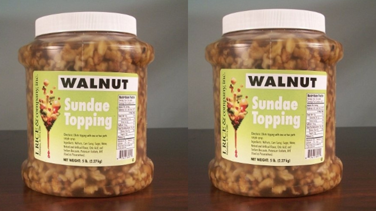 Large plastic jars of I.Rice & Company walnut sundae topping filled with chunky walnuts in syrup.
