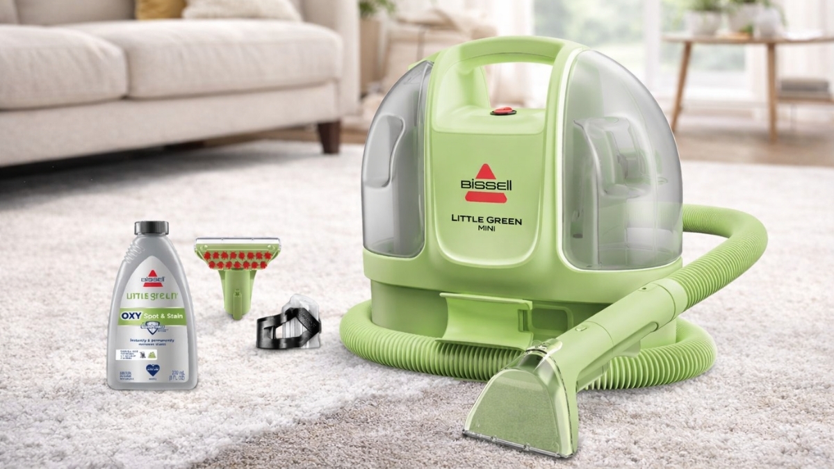 BISSELL Little Green Mini portable carpet cleaner with hose, tools, and cleaning solution on carpet