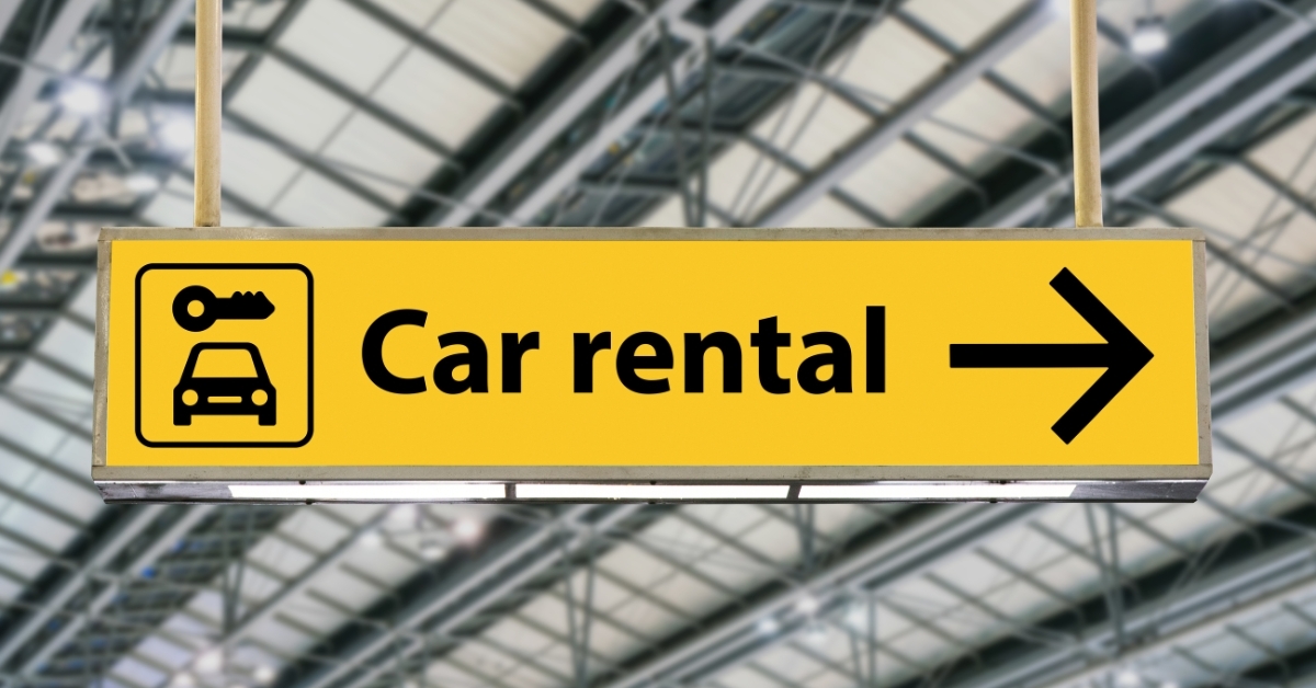 Airport car rental direction sign representing on-demand and short-term vehicle access”