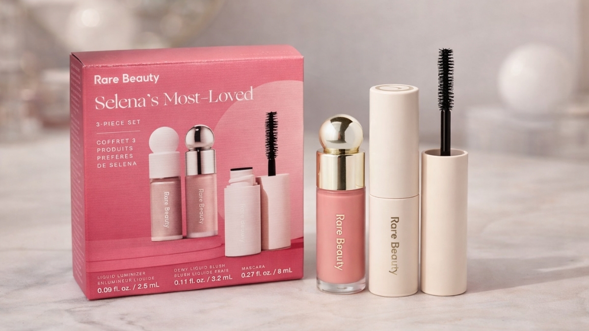 Rare Beauty Selena's Most Loved 3-Piece Set featuring Soft Pinch Liquid Blush, Positive Light Liquid Luminizer, and Perfect Strokes Volumizing Mascara in mini sizes displayed with pink packaging.