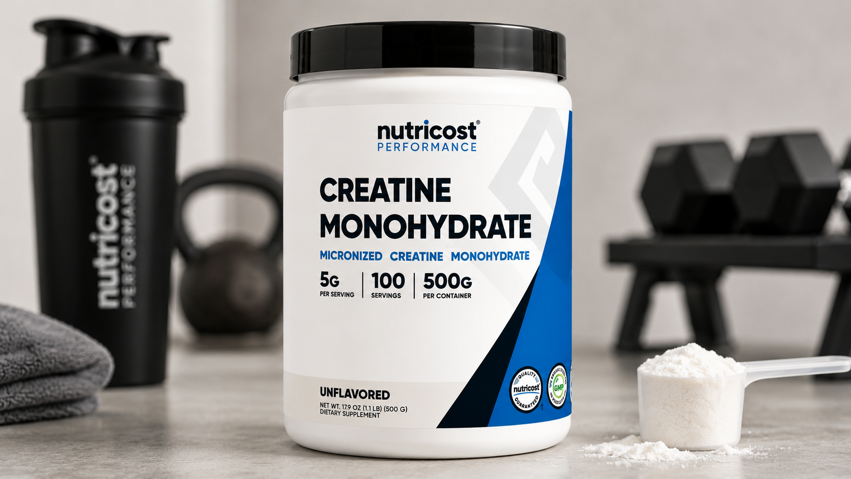 Nutricost Creatine Monohydrate Micronized Powder container beside shaker bottle and gym equipment