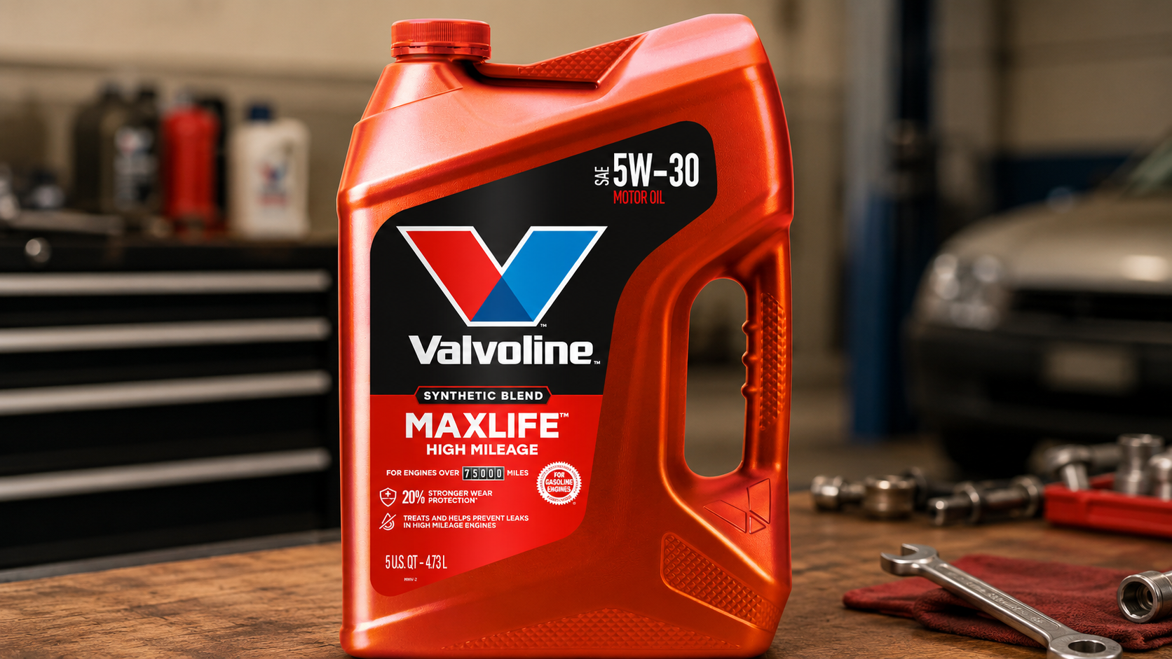 High-angle view of Valvoline MaxLife High Mileage 5W-30 Synthetic Blend Motor Oil beside vehicle engine components during maintenance inspection.