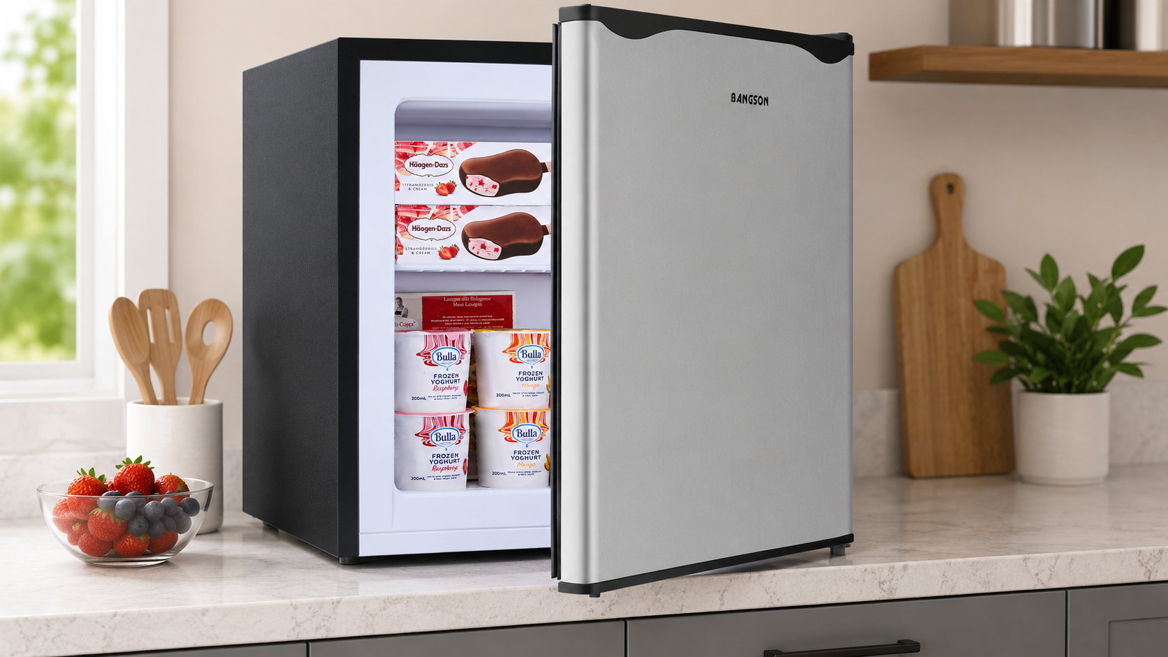 BANGSON Upright Mini Freezer in a small apartment kitchen with organized frozen food storage