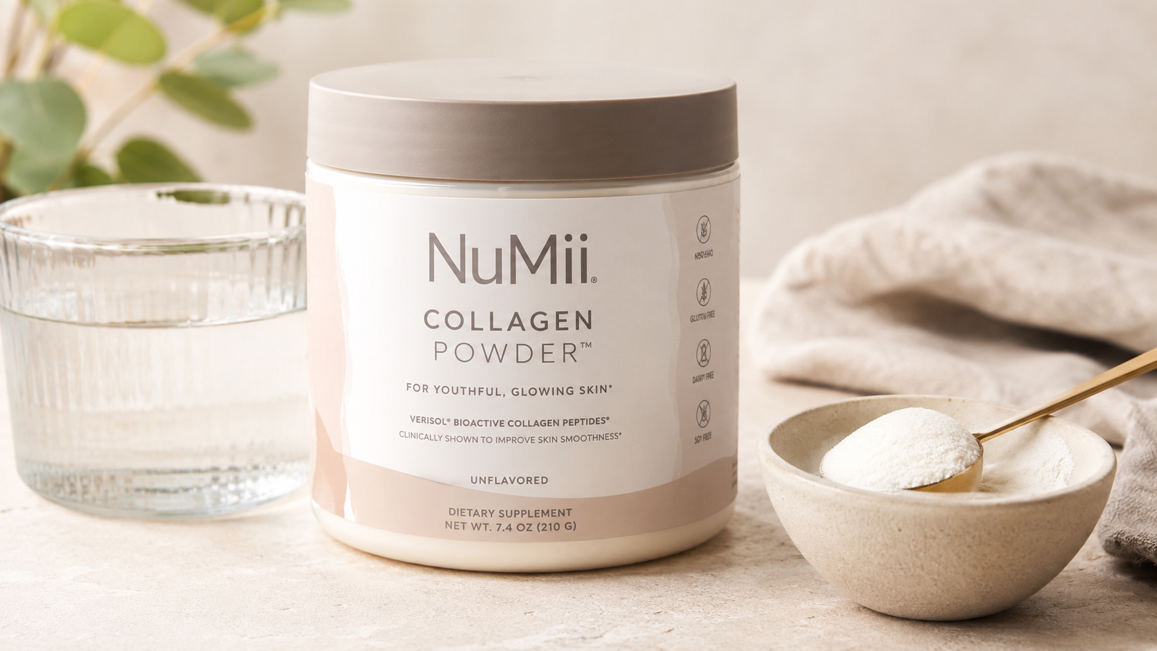 NuMii Collagen Powder unflavored collagen peptides supplement in a minimalist wellness setup with a glass of water and collagen powder scoop for healthy skin support.
