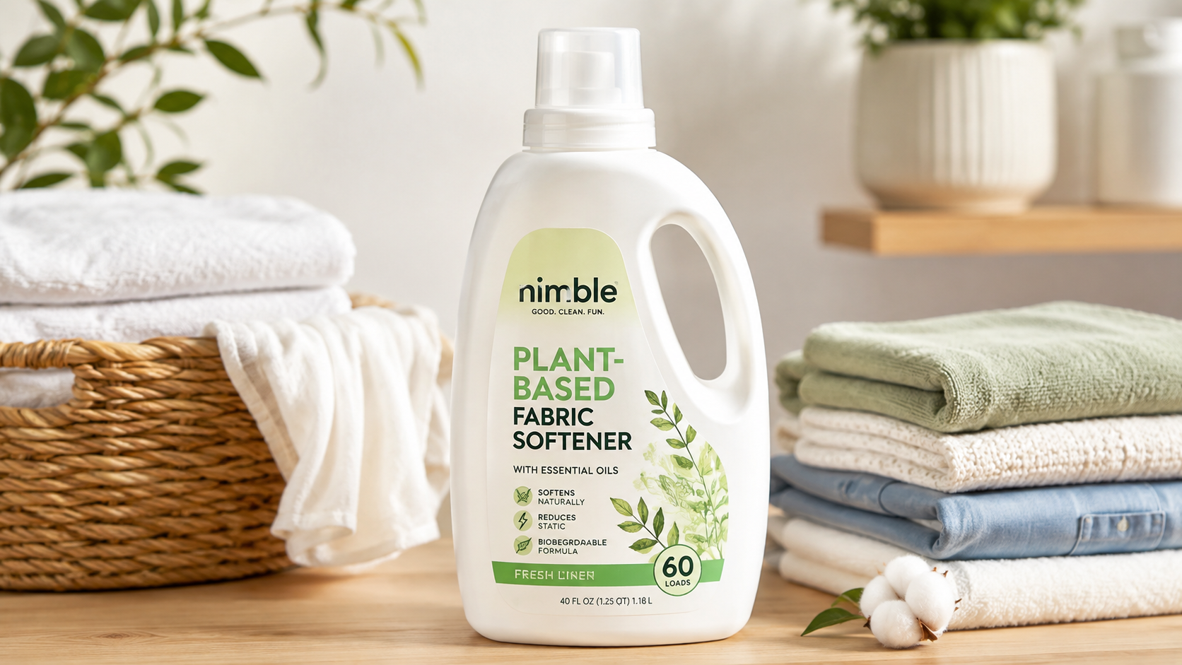 Nimble Plant-Based Fabric Softener bottle displayed with neatly folded towels in a bright laundry room, highlighting its eco-friendly formula for naturally soft, fresh-smelling clothes.