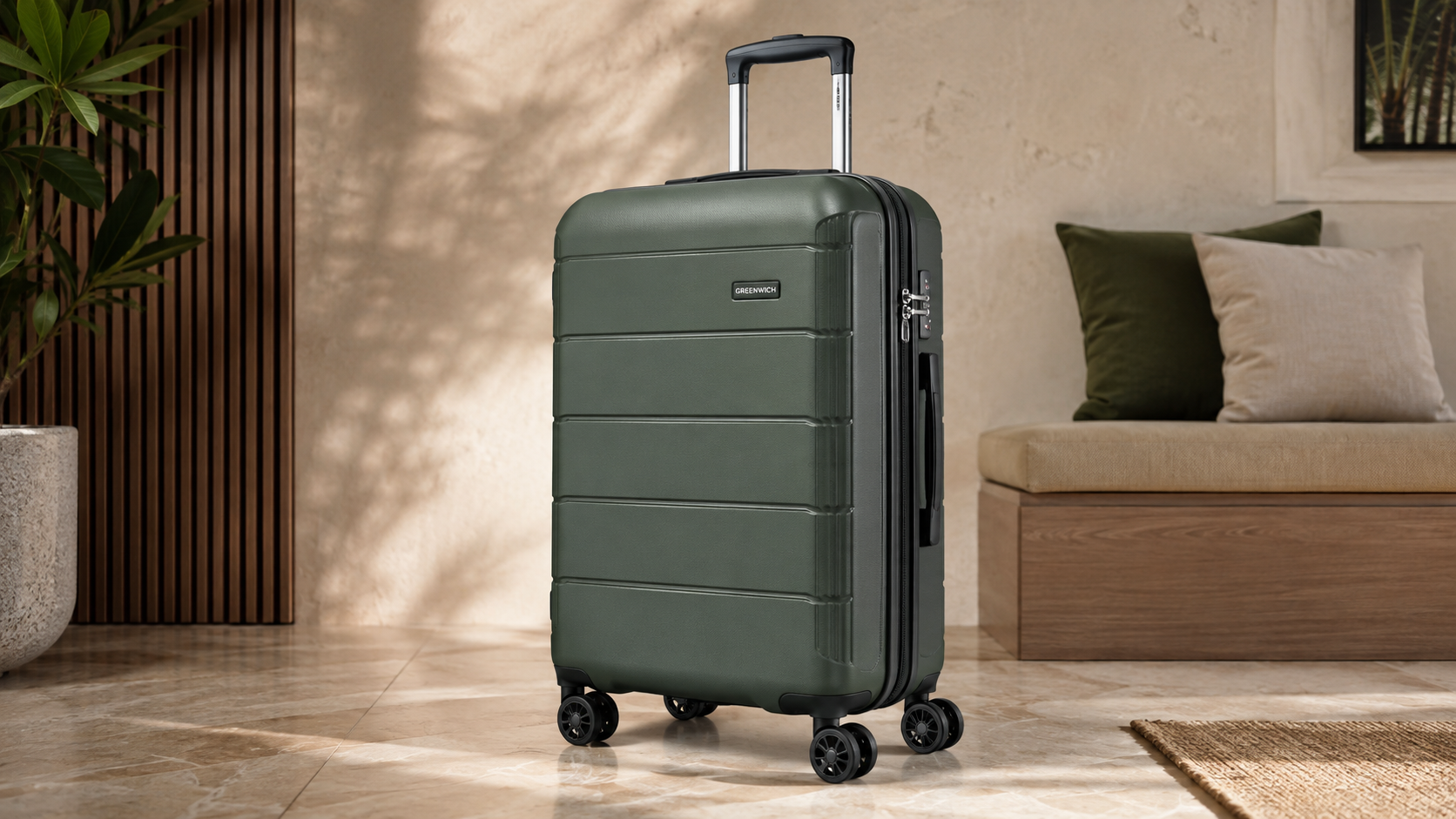 Greenwich Miami M 60L hard-shell suitcase in olive green with spinner wheels, photographed in a modern minimalist interior, ideal for travel and luggage reviews.